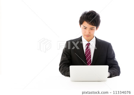 Businessman using a personal computer Businessman using a personal computer 11334076