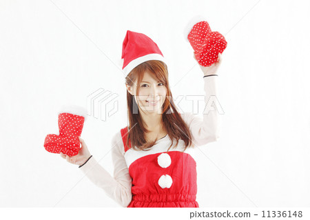 聖誕老人衣物的一名婦女有紅色鞋子的 聖誕老人衣物的一名婦女有紅色鞋子的 11336148