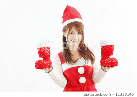 A woman in Santa clothing with red shoes 11336149