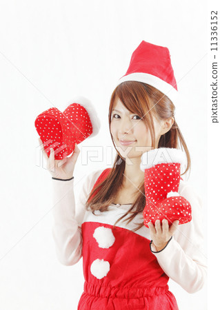 A woman in Santa clothing with red shoes 11336152