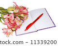 notebook with a pen and flowers 11339200