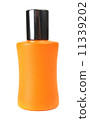 orange small bottle with a perfume liquid 11339202
