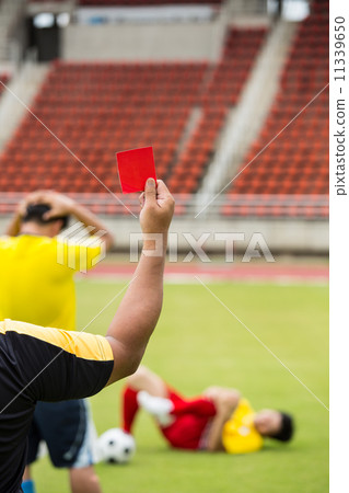 Referee soccer show card for warning and  recorded player foul 11339650