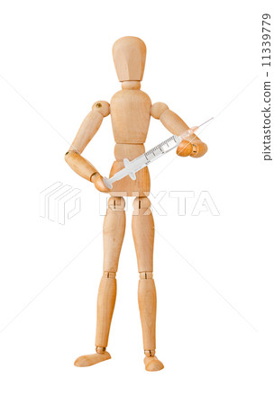 Wooden mannequin holding syringe 11339779