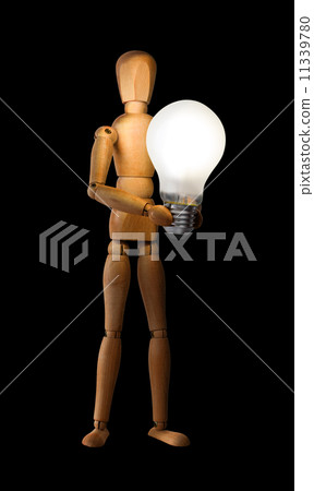 Wooden mannequin holding light bulb 11339780