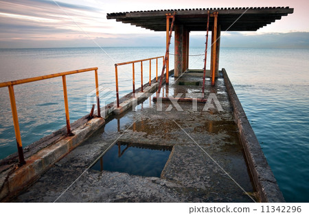 Old pier with red railing. Black Sea coast. Russia, Sochi 11342296