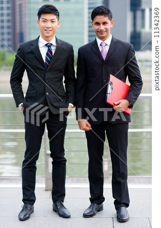 Two young multi-ethnic men in suit looking forward 11342369