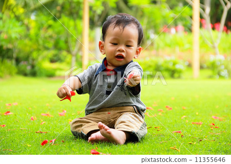young smiling children Boy with flower in hand young smiling children Boy with flower in hand 11355646