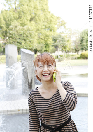 Young woman talking on a smartphone 11357553