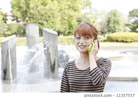 Young woman talking on a smartphone 11357557