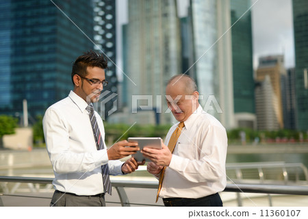 Businessman having discussion using tablet 11360107