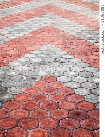Abstract background texture of cobblestone paving road with red and gray arrows 11360889