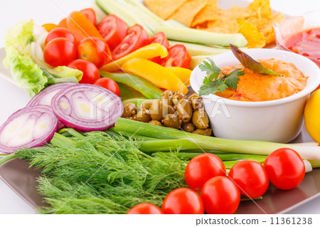 Vegetables, olives, nachos, red and cheese sause Vegetables, olives, nachos, red and cheese sause 11361238