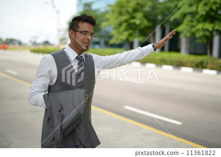 Businessman flagging for cab 11361822