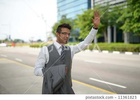 Businessman flagging for cab 11361823