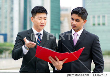 Male Agent providing business advise to Businessman 11362494