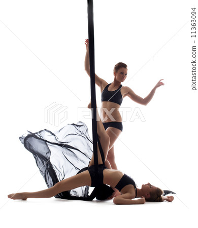 Cute athletic girls dancing with silk ropes 11363094