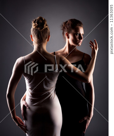 Portrait of sexy female dancers hugging in studio Portrait of sexy female dancers hugging in studio 11363095