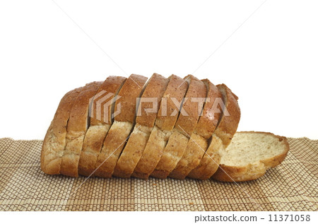 sliced whole wheat bread on wood 11371058