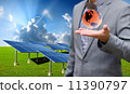 Sustainable energy concept, Solar farm with businessman carry virtual world 11390797