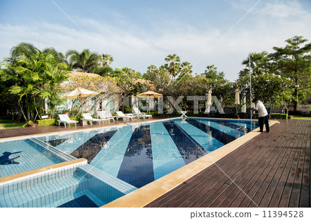 People was cleaning the pool People was cleaning the pool 11394528