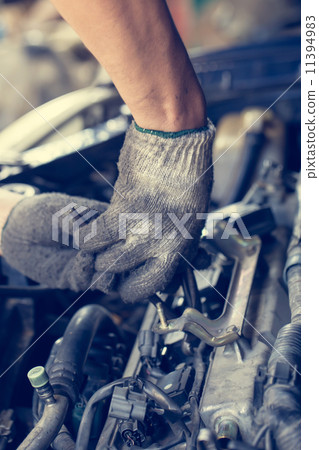 Hands of car mechanic in auto repair service Hands of car mechanic in auto repair service 11394983
