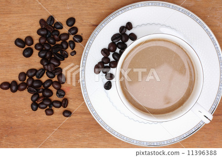 Coffee beans with coffee. wood background Coffee beans with coffee. wood background 11396388