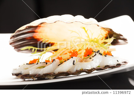 scallops presented on a scallop shell 11396972