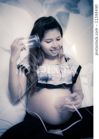 Beautiful Asian woman with a pretty smile. 're Happy with pregna 11398490