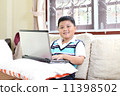 Asian boy playing notebook for learning 11398502