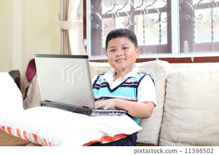 Asian boy playing notebook for learning 11398502
