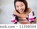 Beautiful Asian woman with a pretty smile. 're Happy with pregna 11398504