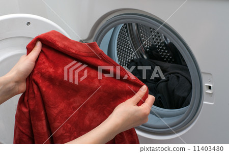Loading clothes Loading clothes 11403480