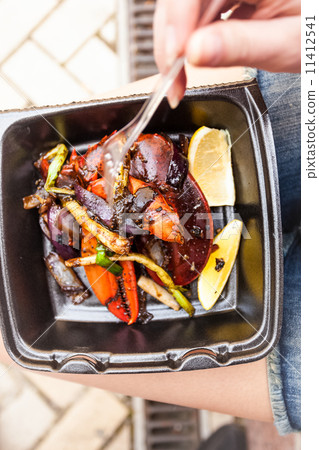photo of woman eating lobster claw with fork photo of woman eating lobster claw with fork 11412541