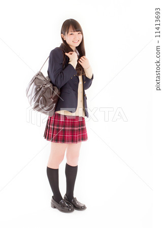 穿著時興的西裝外套的一個俏麗的女學生 穿著時興的西裝外套的一個俏麗的女學生 11413693