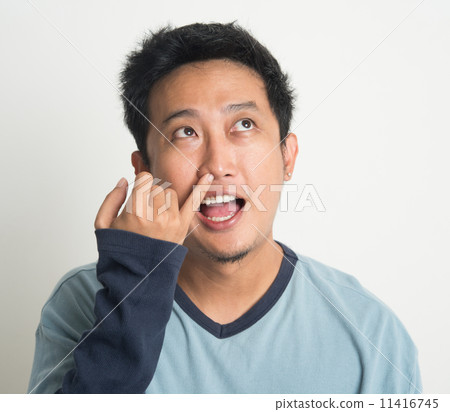 Asian man picking nose 11416745