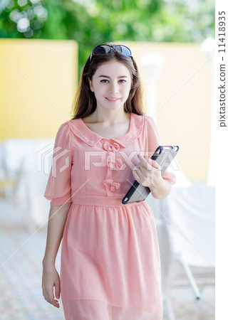 young attractive woman holding tablet 11418935