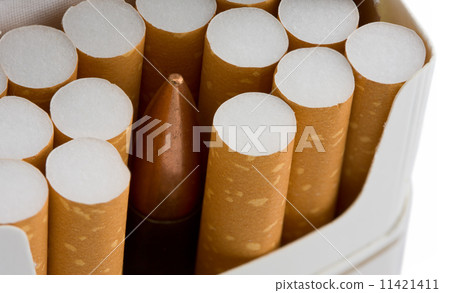 Bullet in cigarette pack isolated on white 11421411