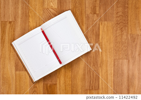 Blank notepad with office supplies on wooden table. Blank notepad with office supplies on wooden table. 11422492