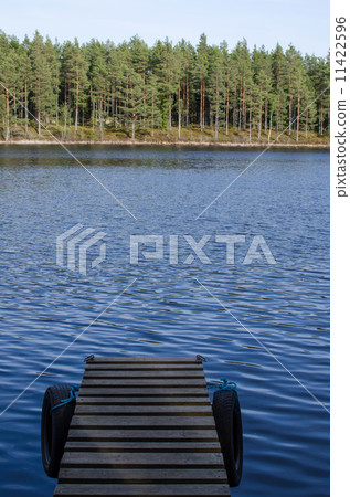 Detail of jetty in calm water 11422596