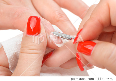 manicure applying - cleaning the cuticles  11422670