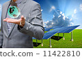 Sustainable energy concept, Solar farm with businessman carry virtual world 11422810