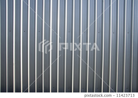 Corrugated metal sheet fence with natural grainy texture 11423713