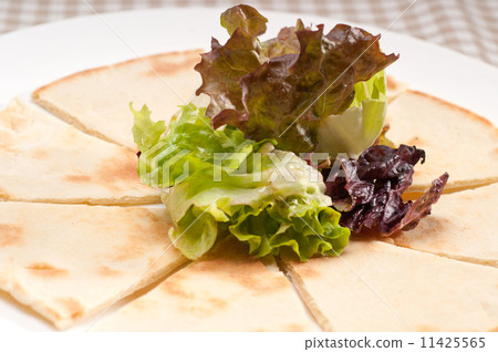 garlic pita bread pizza with salad on top 11425565