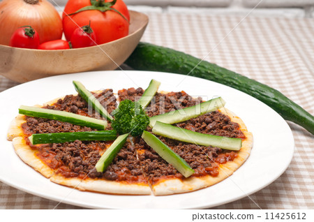 Turkish beef pizza with cucumber on top 11425612