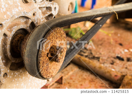 Old pulley and belt of the lawnmowe 11425815