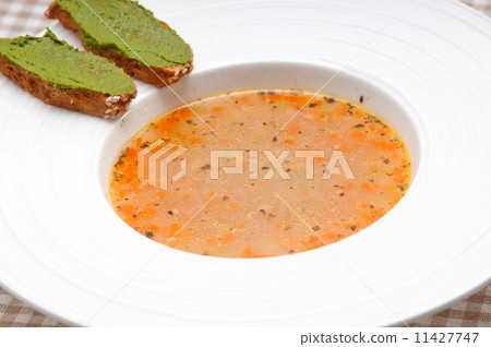 Italian minestrone soup with pesto crostini on side Italian minestrone soup with pesto crostini on side 11427747