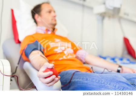 Blood donor at donation. Blood donor at donation. 11430146
