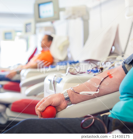 Blood donor at donation. Blood donor at donation. 11430175