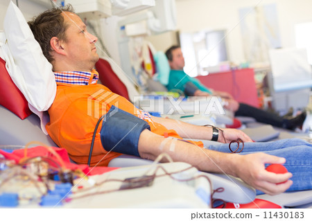 Blood donor at donation. Blood donor at donation. 11430183